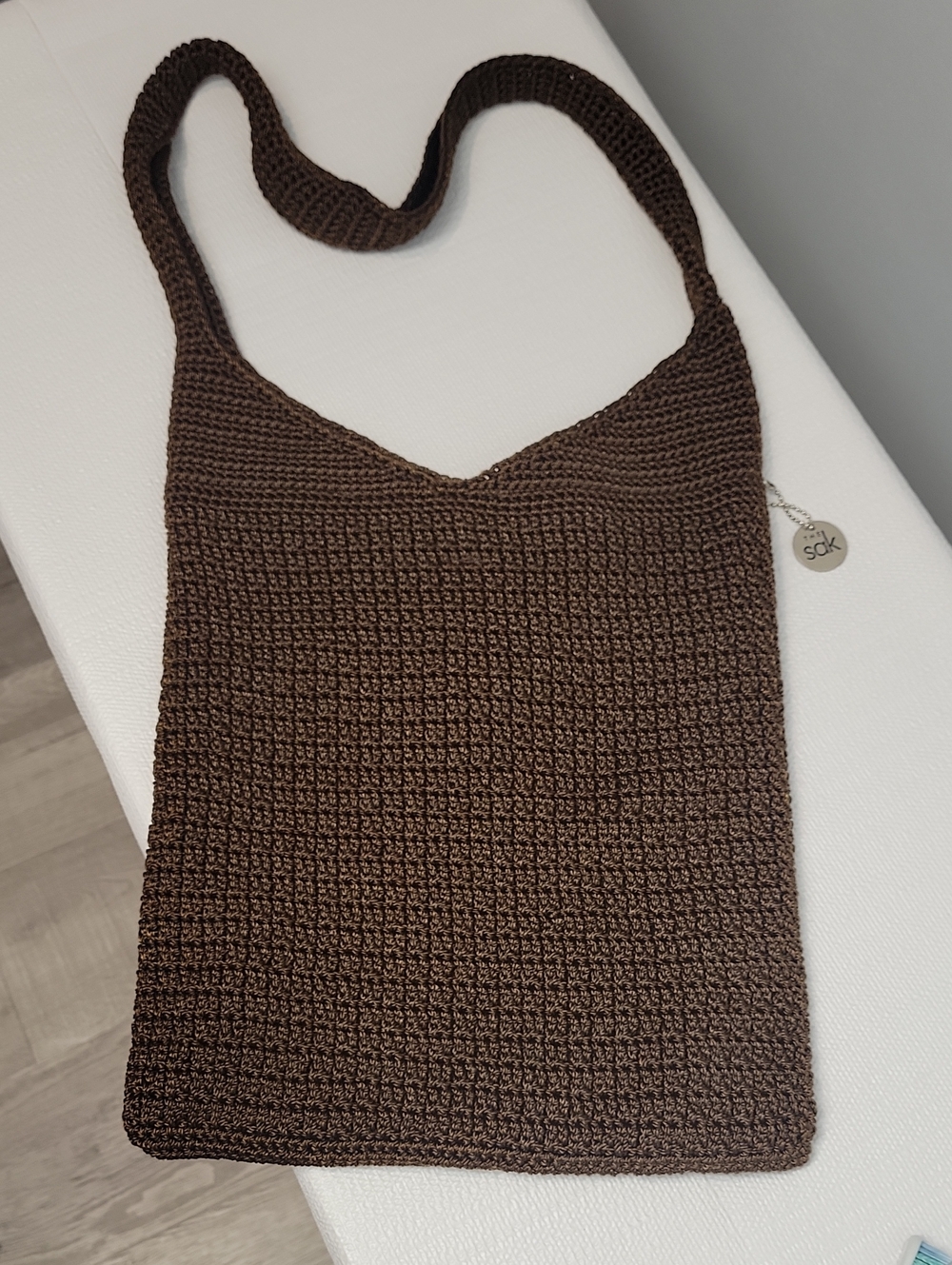 The SAK brown crochet hobo shoulder bag